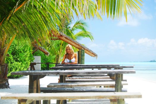 woman in a tropical cafe