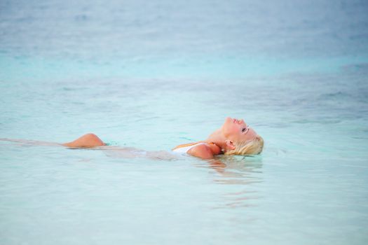 woman  playing in ocean water