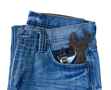 Blue jeans pocket with old tool on white background
