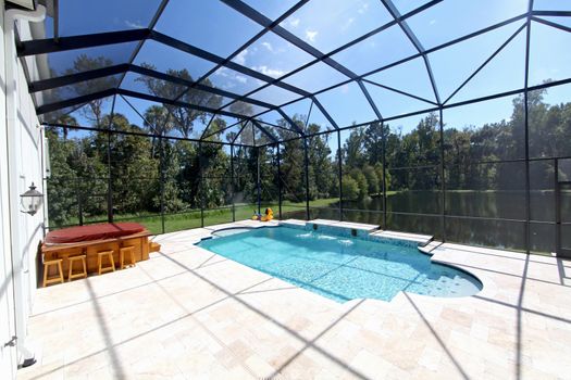 A Swimming Pool and Hot Tub with Lake View.