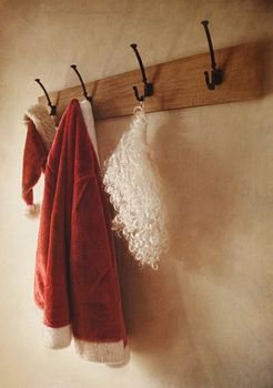Santa costume hanging on coat rack with vintage look