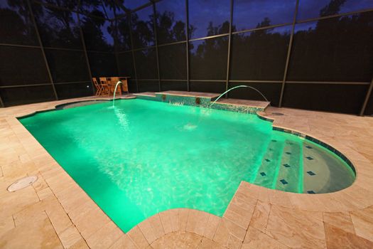 A Swimming Pool lit up at night