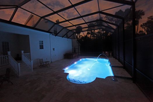 A Swimming Pool lit up at night