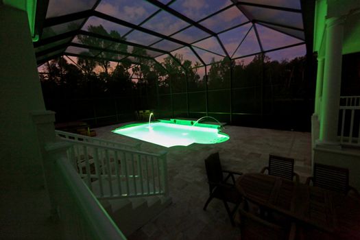 A Swimming Pool lit up at night