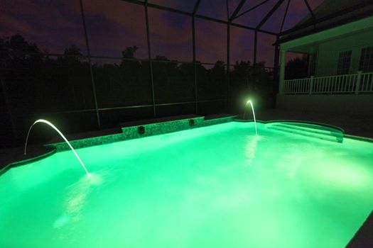 A Swimming Pool lit up at night