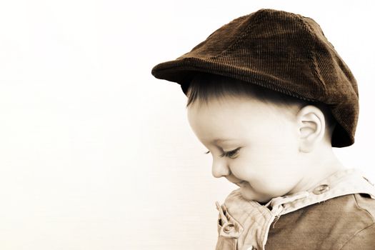 Adorable baby boy wearing a stylish hat