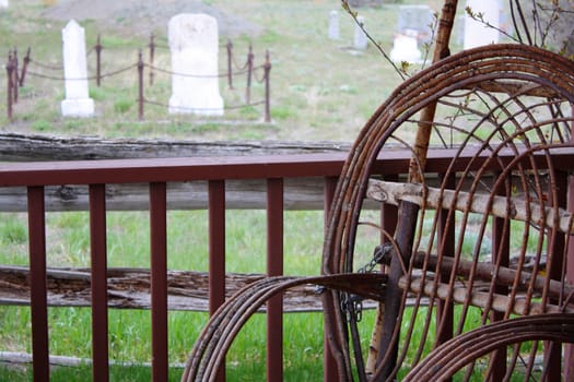 Old wicker on porch with cemetry in background