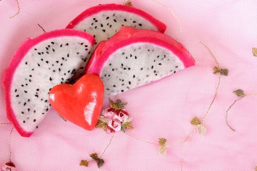 Pink pitahaya dragon fruit background sliced in pieces 