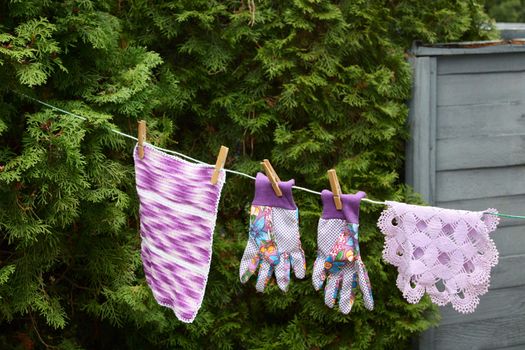 Gloves and cloths hanging outside to dry