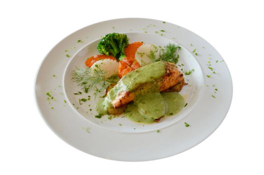 a delicious salmon steak with green sauce