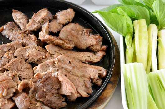 roasted beef fillet on a hot plate ,served with vegetable