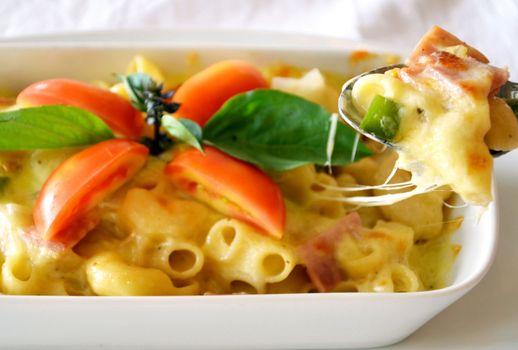 a delicious macaroni with cheese and tomato