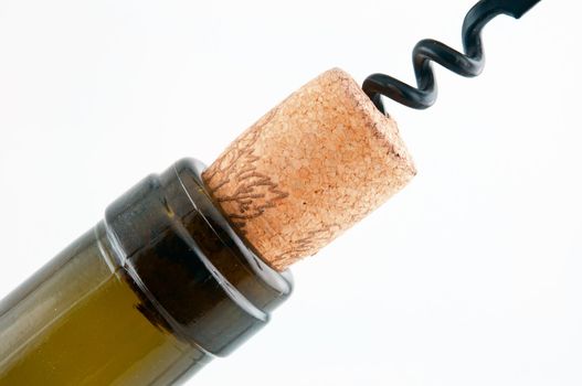 Dark brown bottle with a cork and corkscrew which is screwed into the cork