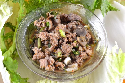 Thai dish of spicy minced pork eaten with vegetable