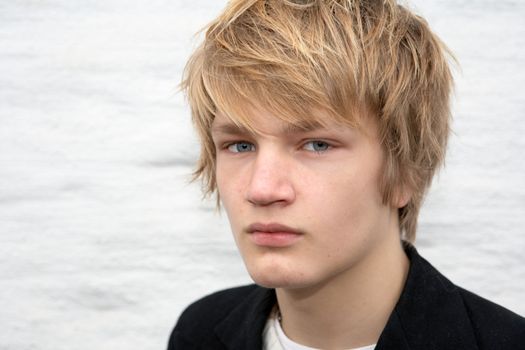 Portrait of teenage boy, looking at camera