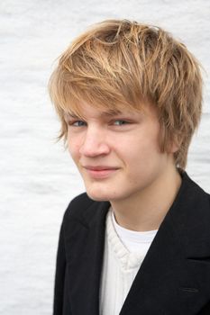 Portrait of smiling teenage boy, looking at camera