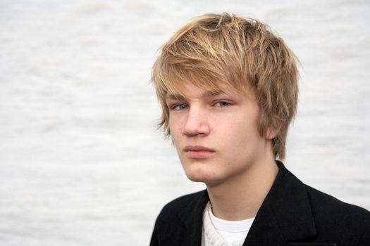 Portrait of serious teenage boy, looking at camera