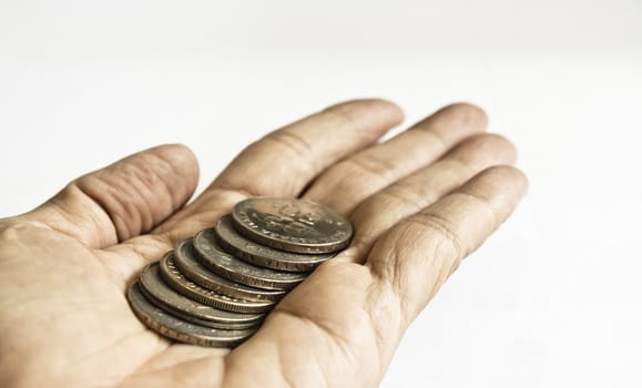 A show of some coins in a stretched out hand