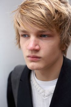 Portrait of teenage boy, close-up exterior