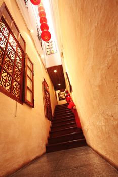 Chinese traditional corridor in wooden with red lantern.