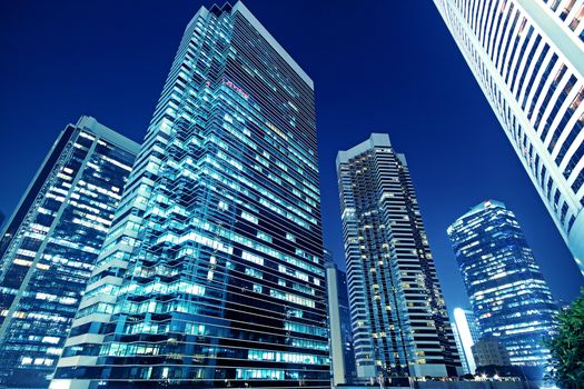 Tall office buildings by night 