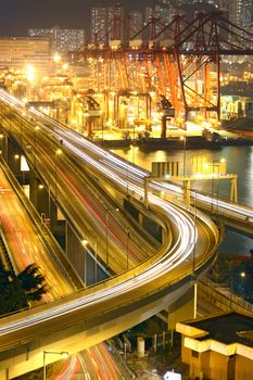 Overpass at night through the port