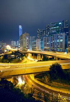 Colorful city night with buildings and bridge