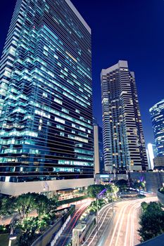 Tall office buildings by night 