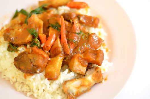 Stir fried crispy pork with red curry paste and rice