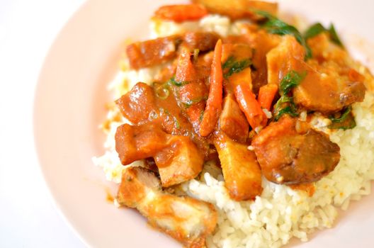 Stir fried crispy pork with red curry paste and rice