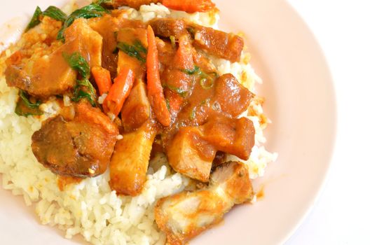 Stir fried crispy pork with red curry paste and rice