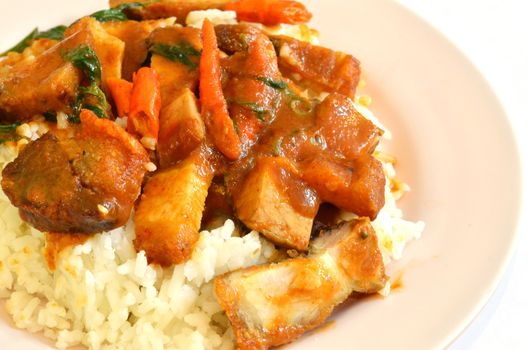 Stir fried crispy pork with red curry paste and rice