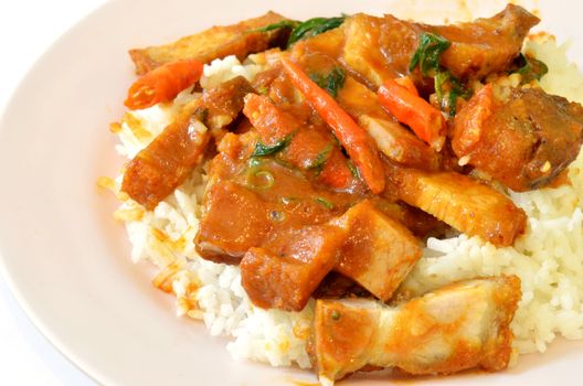 Stir fried crispy pork with red curry paste and rice