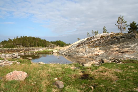 north: stones, pond and rocks
