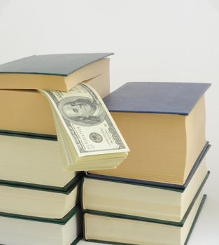 Money in Book on White Background. Save 
Bookmark in Hundred Dollars.