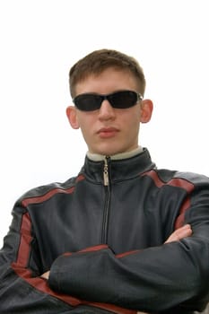 Young man in a black glasses and a leather jacket