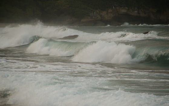 Enjoy waves on tropical beach in Colombia