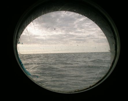 View of the sea through a yacht window