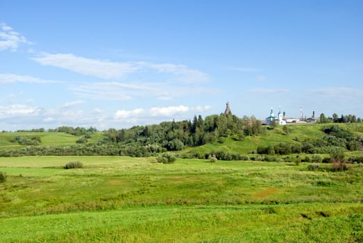 Year landscape,green hill,emerald herb, blue sky