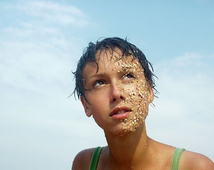 The image of the girl whose face in sand