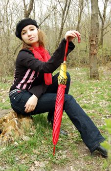 elegant girl posing wizh red umbrella