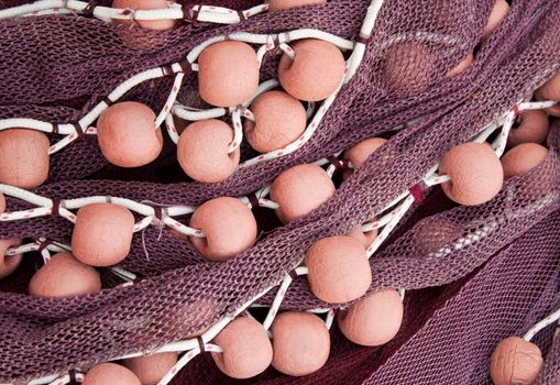 Closeup of a fishing net and floats.