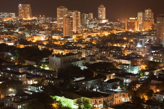 Aerial view of modern quarter of Vedado in Havana, Cuba, at night.