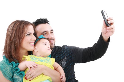 Closeup of happy family smiling over white background taking self portrait