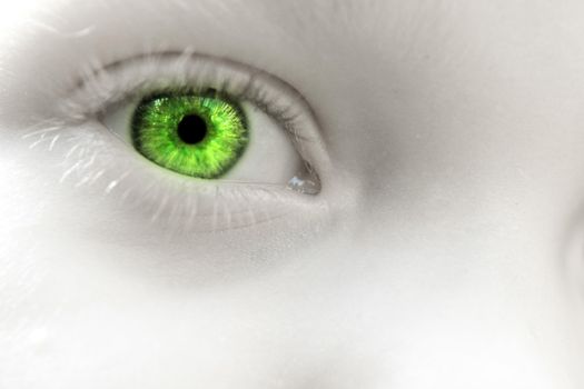 A child with green eyes close up