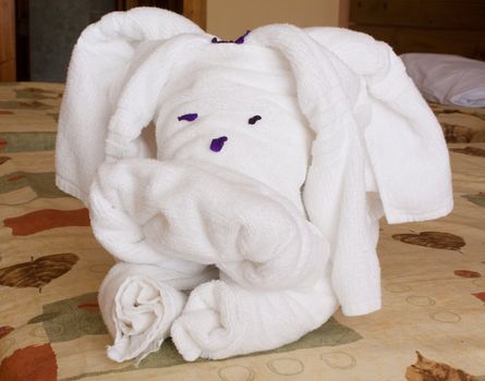 Towels in the shape of a dog on the bed of a hotel room in Cuba.