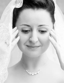 Portrait of the beautiful bride in a veil