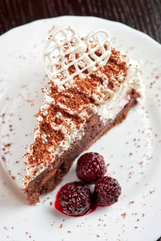 fresh tasty baked blackberry cake closeup at white plate