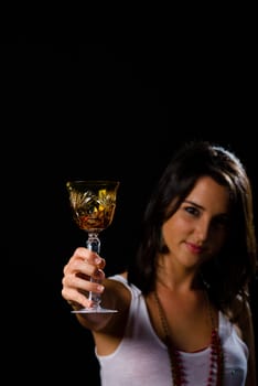 Brunette toasting with a classy crystal wine glass