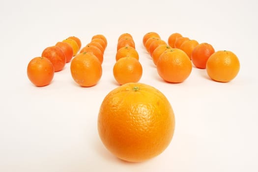 oranges arranged on a white background symbolizing teamwork, leadership............